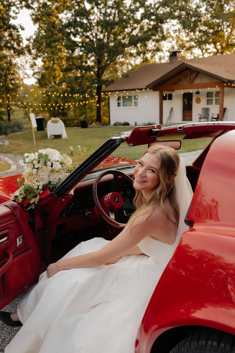 Bride in vintage red Corvette - bridal makeup by Vandyland Makeup